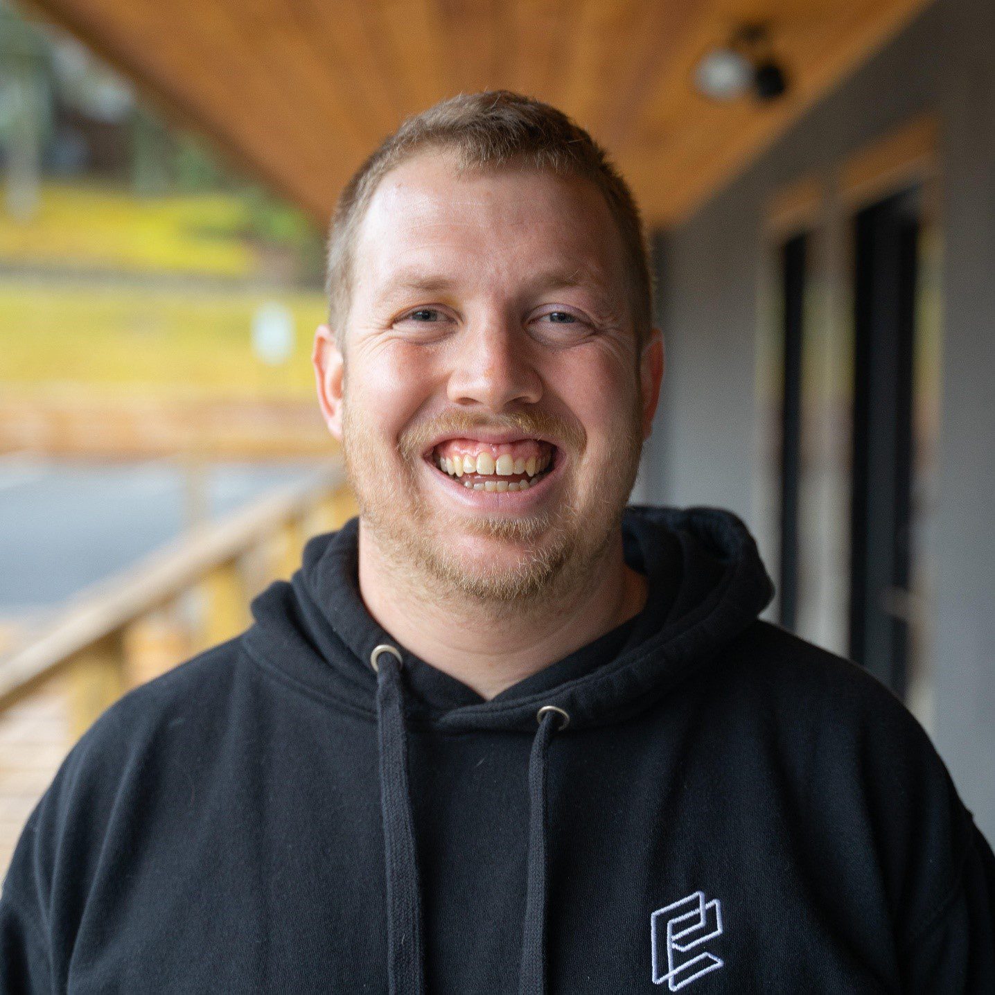 Andrew Chambers from Excel College smiling at the camera
